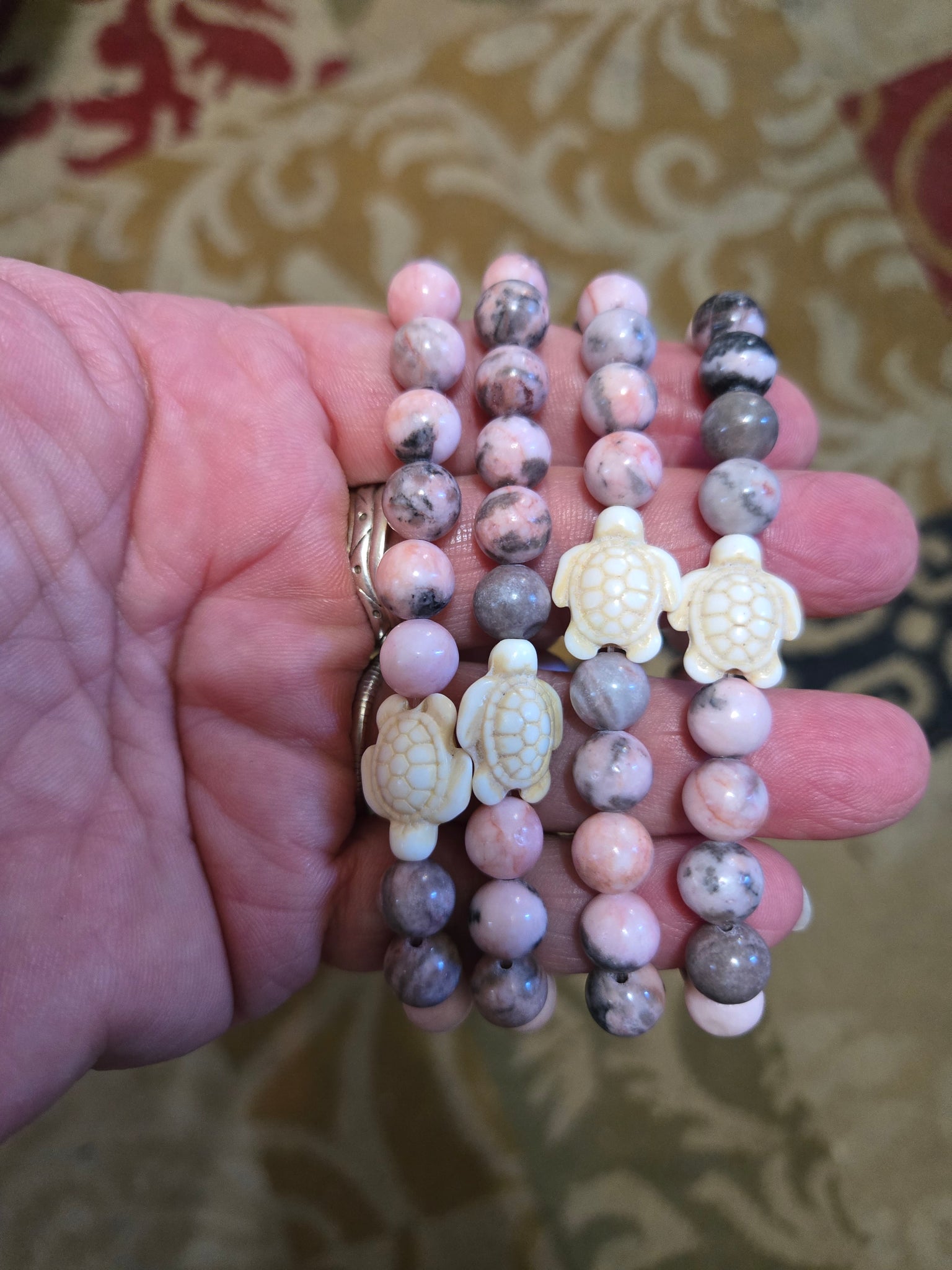 Gemstone Bracelets- Rhodocrosite with Howlite Turtle 8mm Bead Bracelet